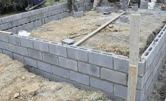 Professionals building a foundation with blocks in Rockford, IL