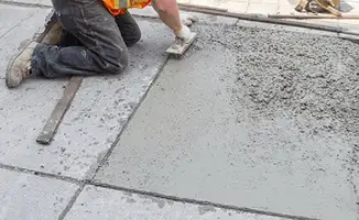 Professional repairing a concrete floor in Rockford, IL