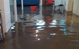 Basement with boiler, cabinets and washing machine completely flooded in Rockford, IL